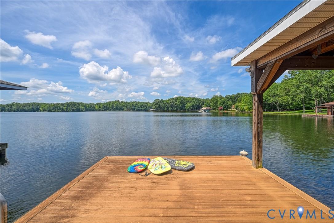 Image 1: View of cove from Boathouse with lift, decking, an