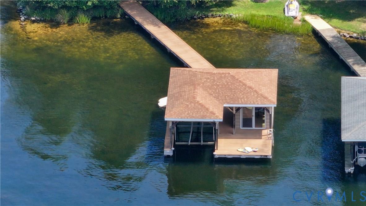 Image 4: Dock area featuring a covered lift and enclosed po
