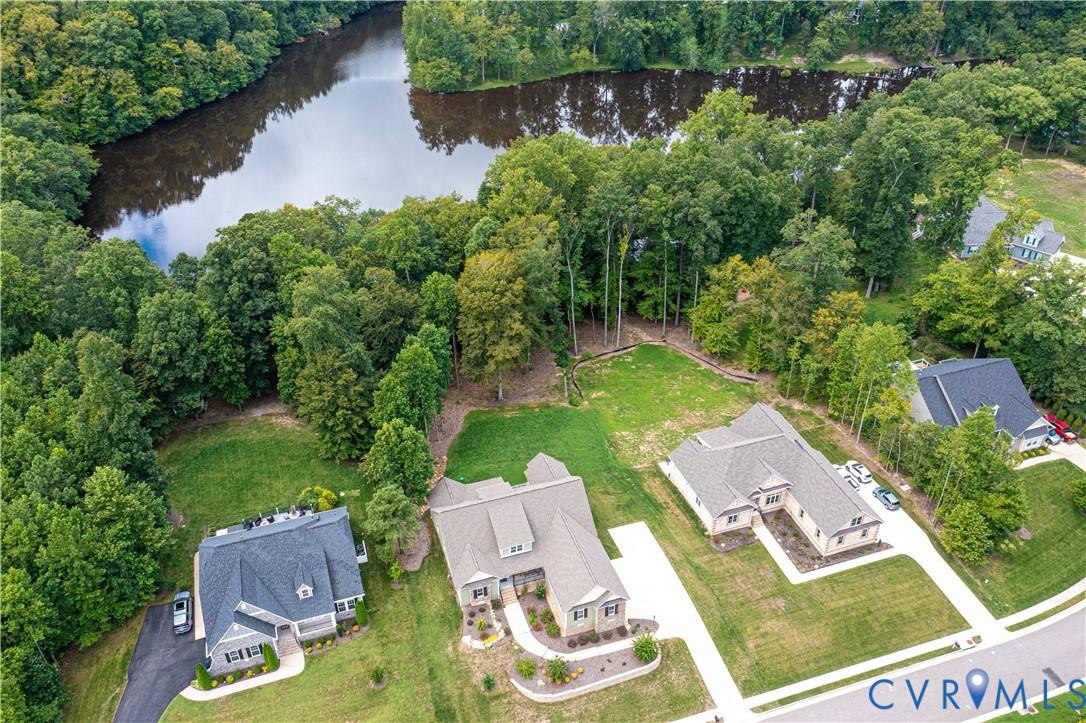 Image 3: Bird's eye view of a nearby body of water and a fo