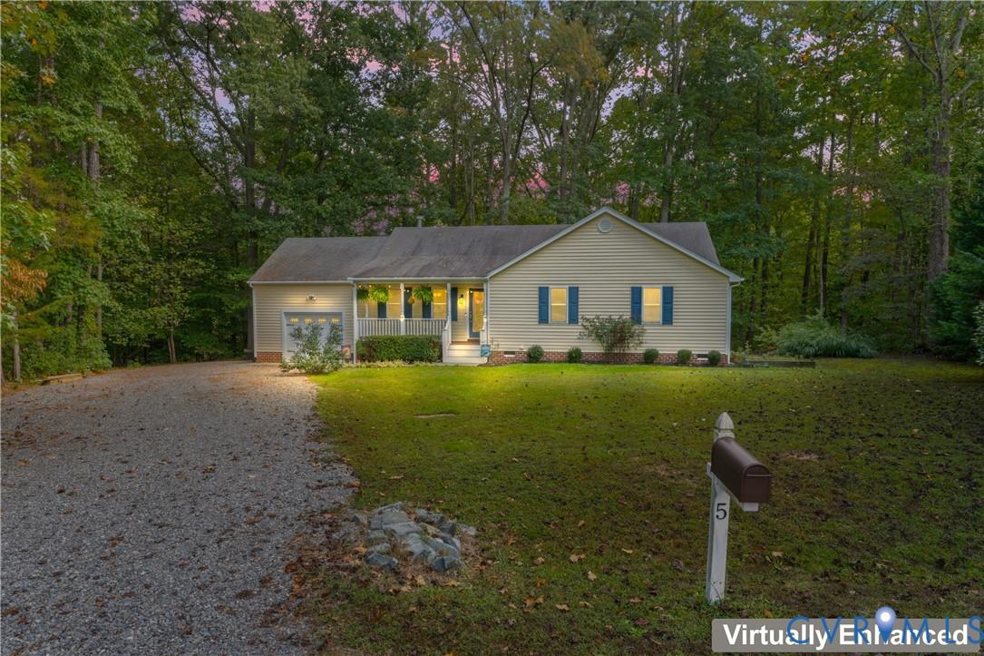 Image 2: Ranch-style house featuring covered porch, gravel