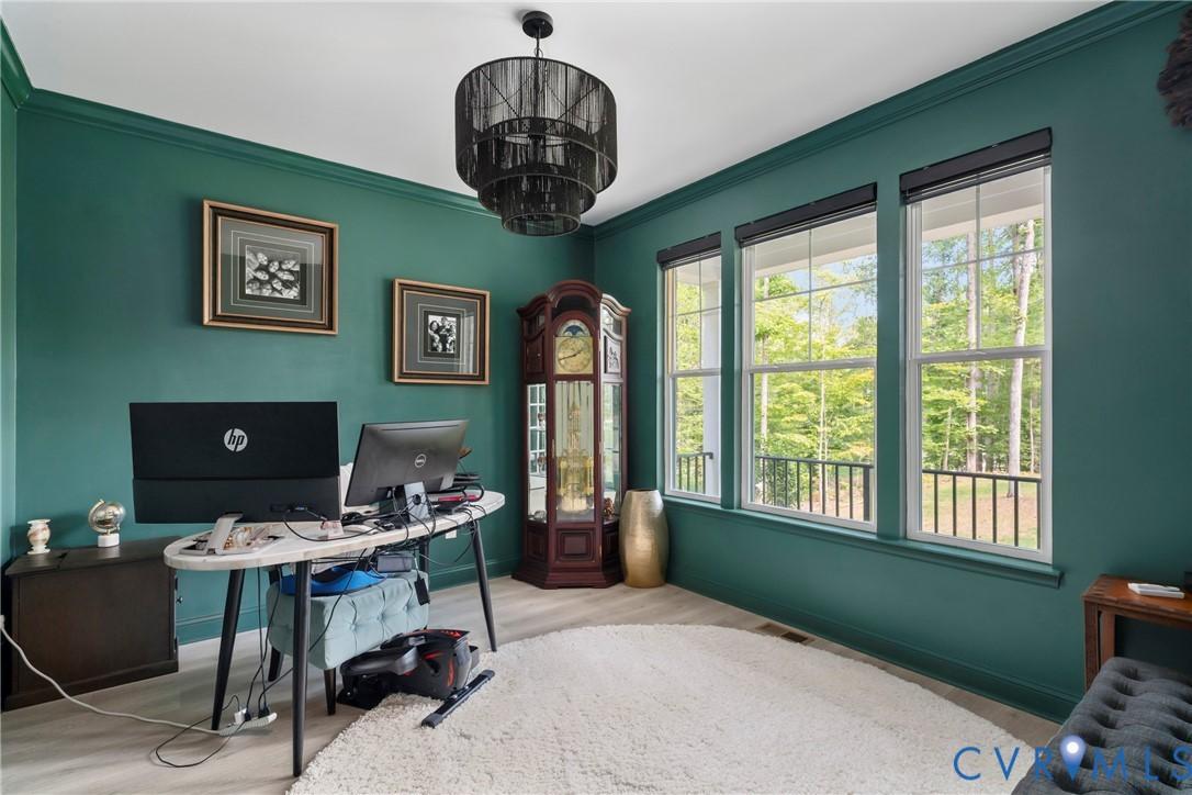 Image 4: Office area featuring ornamental molding and wood