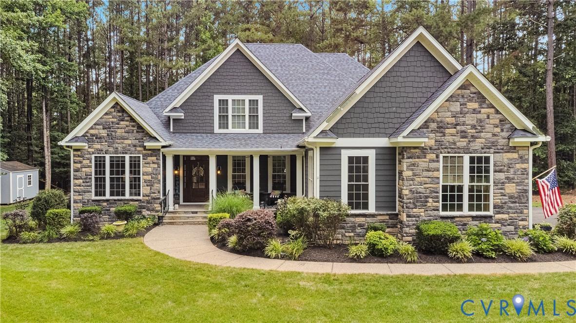 Image 2: Stone and siding exterior with gabled roof lines