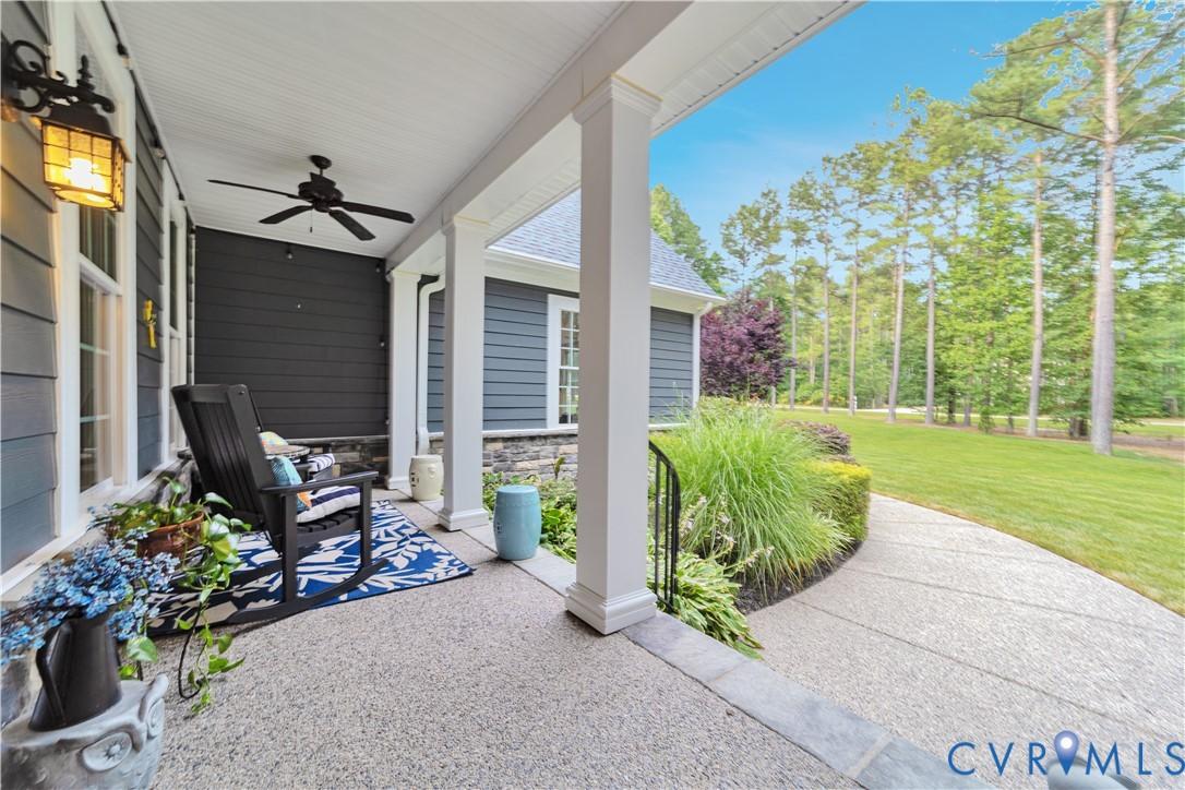 Image 4: Expansive covered front porch featuring a ceiling