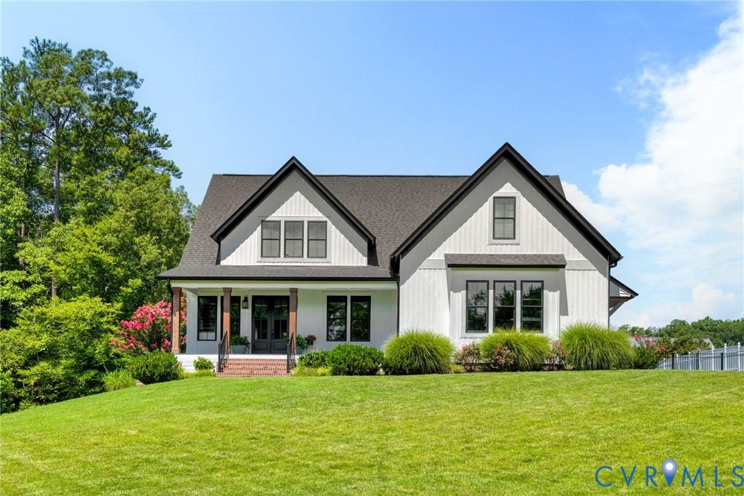 Image 3: Modern farmhouse-style exterior featuring white si