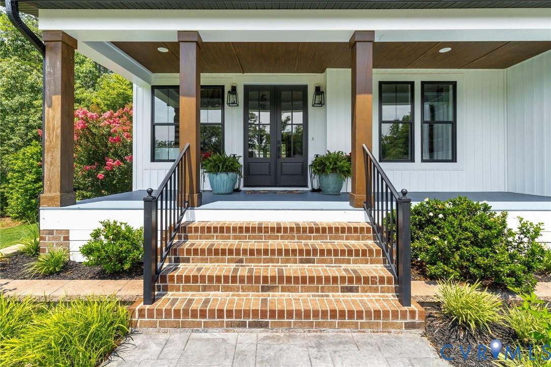 Image 4: Front porch entry featuring multi-toned brick step