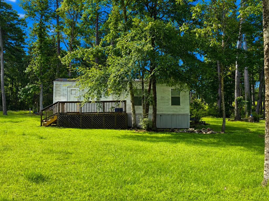 Image 2: Smaller, corner mobile home. Sold as non-realty.