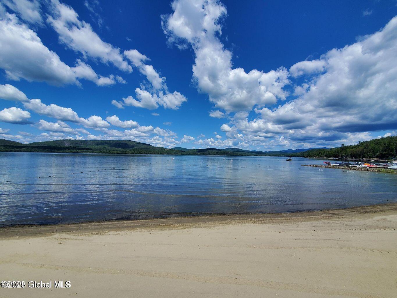 Image 3: beach looking at igh peaks