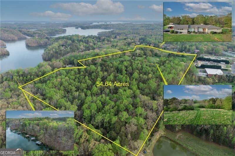 Image 1: Birds eye view of property with a water view