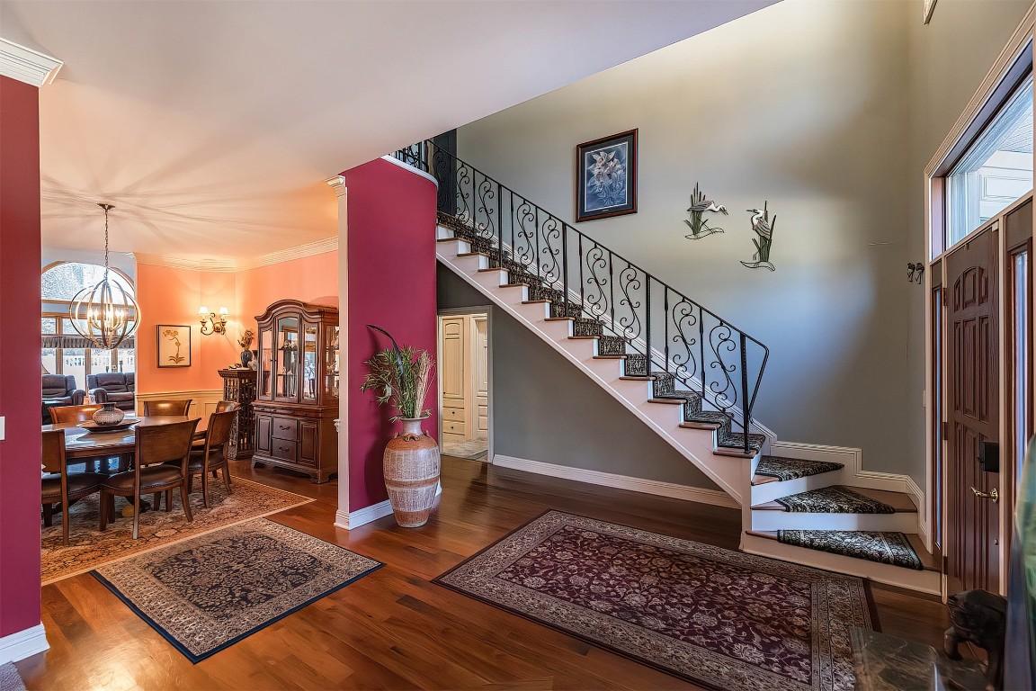 Image 2: The grand foyer says Welcome Home.