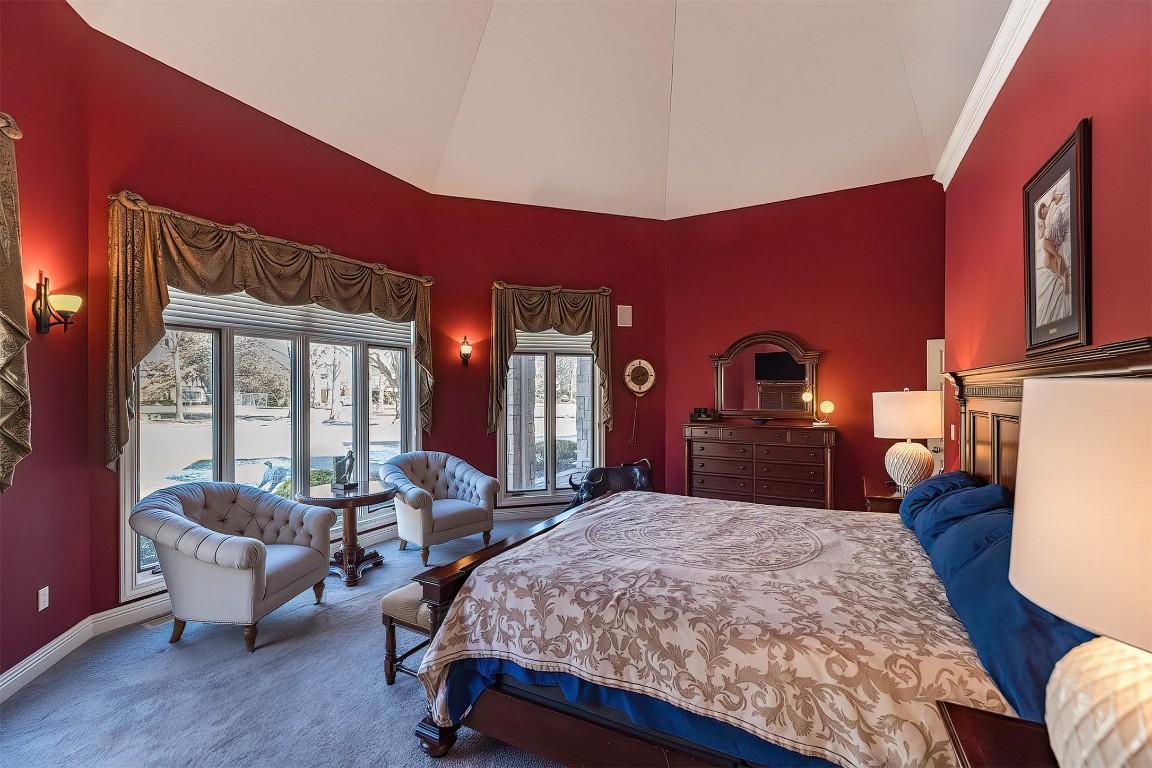 Image 4: First floor primary bedroom serves as a private oa