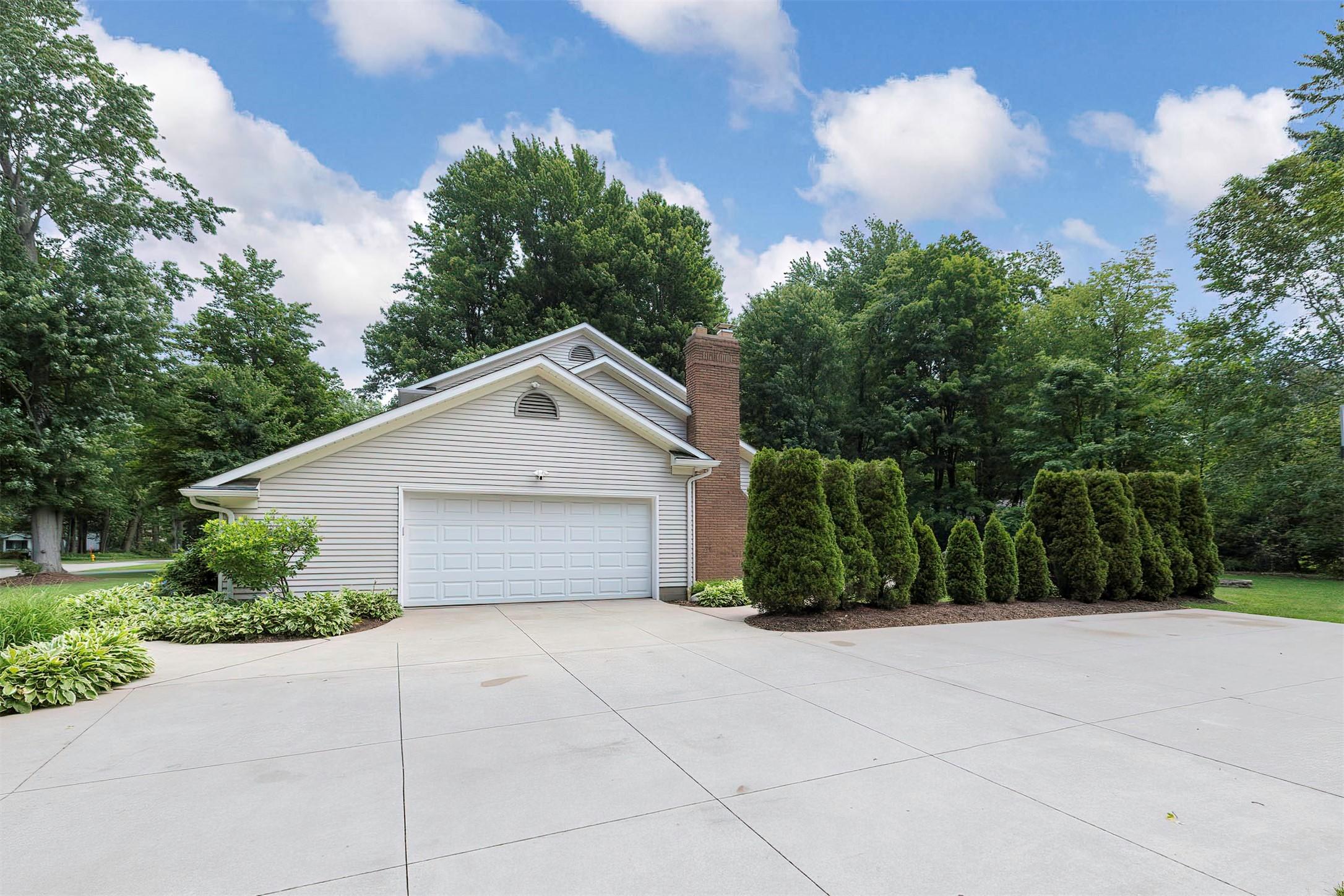 Image 2: Newer concrete drive, patio, porch and walkways