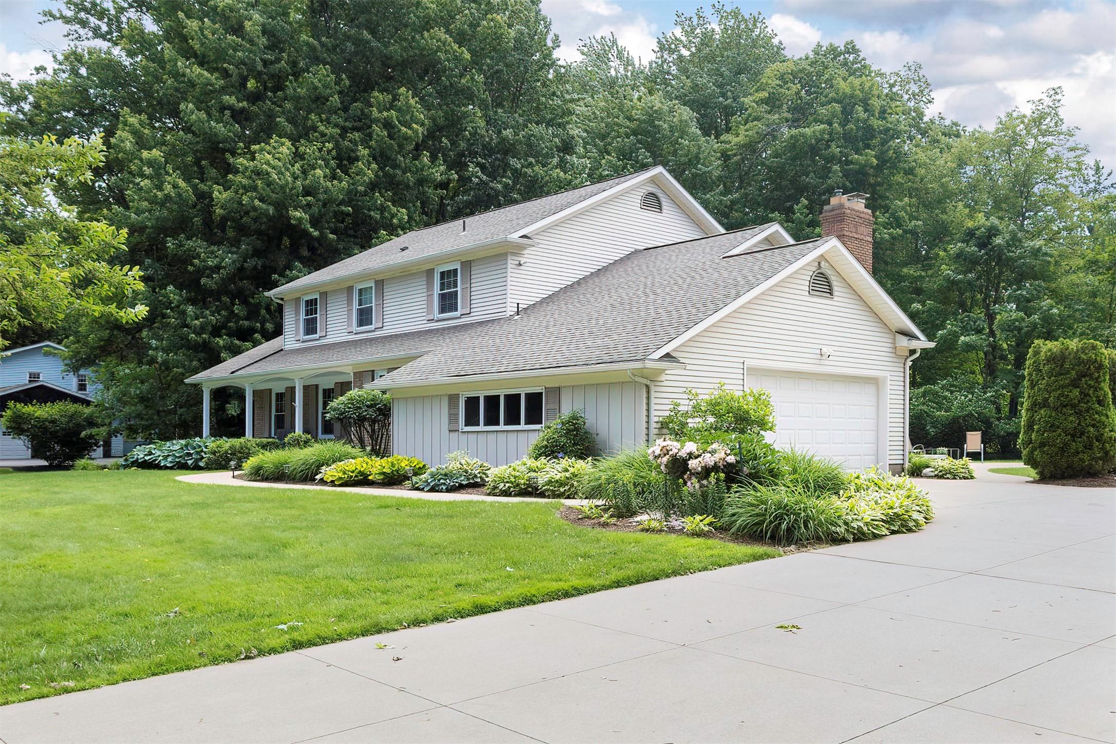 Image 4: Pristine landscaping adds to this home's charm
