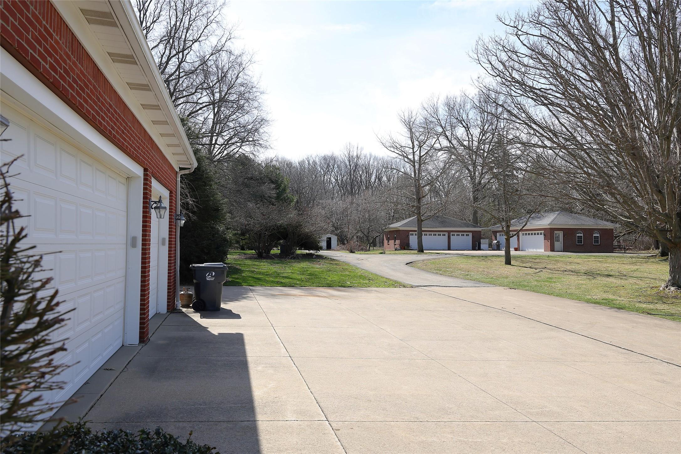 Image 3: Three Attached Garage + Three Car and Four Car Det