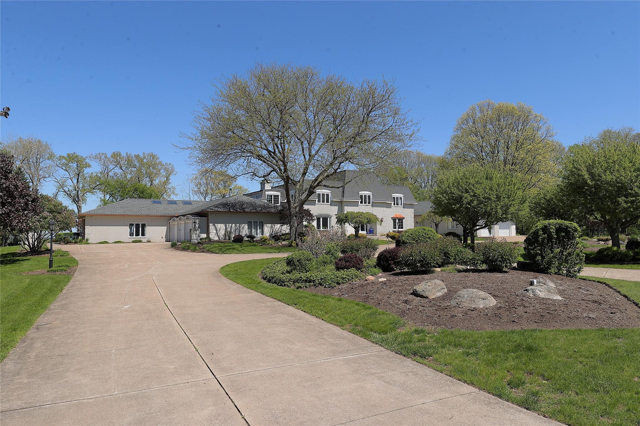 Image 3: Front of Home with Circular Driveway