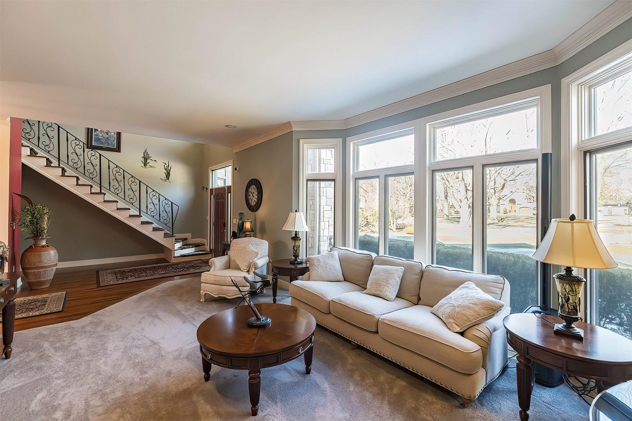 Image 2: Sunlight cascades into the formal Living Room.