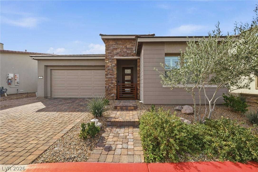 Image 4: View of front of home featuring decorative drivewa