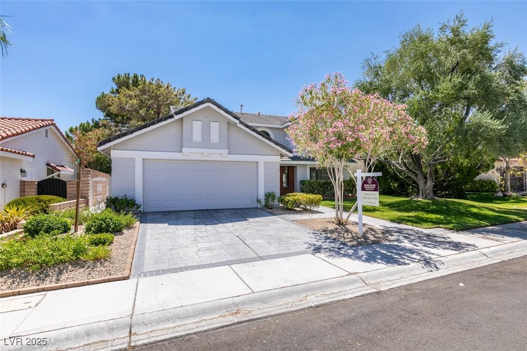 Image 3: Traditional-style home with an attached garage, co