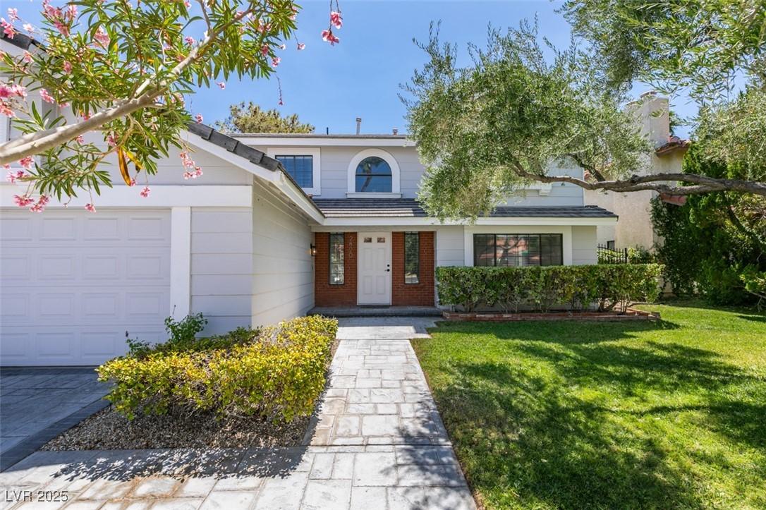 Image 4: Traditional-style home with an attached garage, a