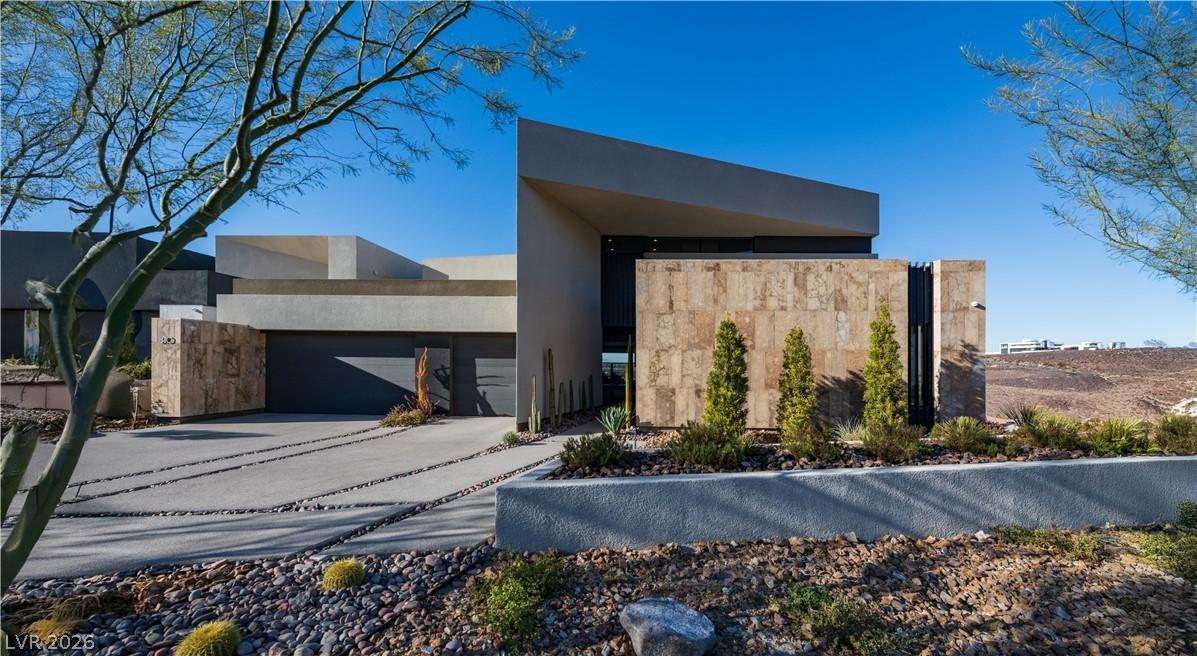 Image 2: Bold lines and natural desert landscaping define t