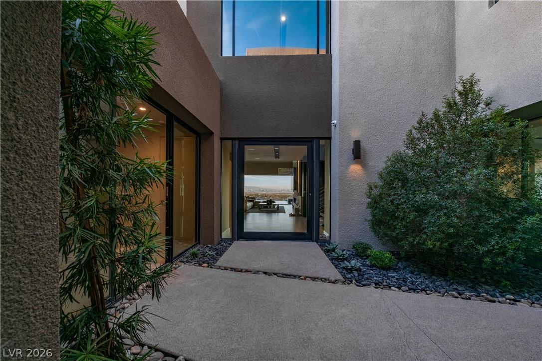 Image 3: An inviting entry to this contemporary home with s