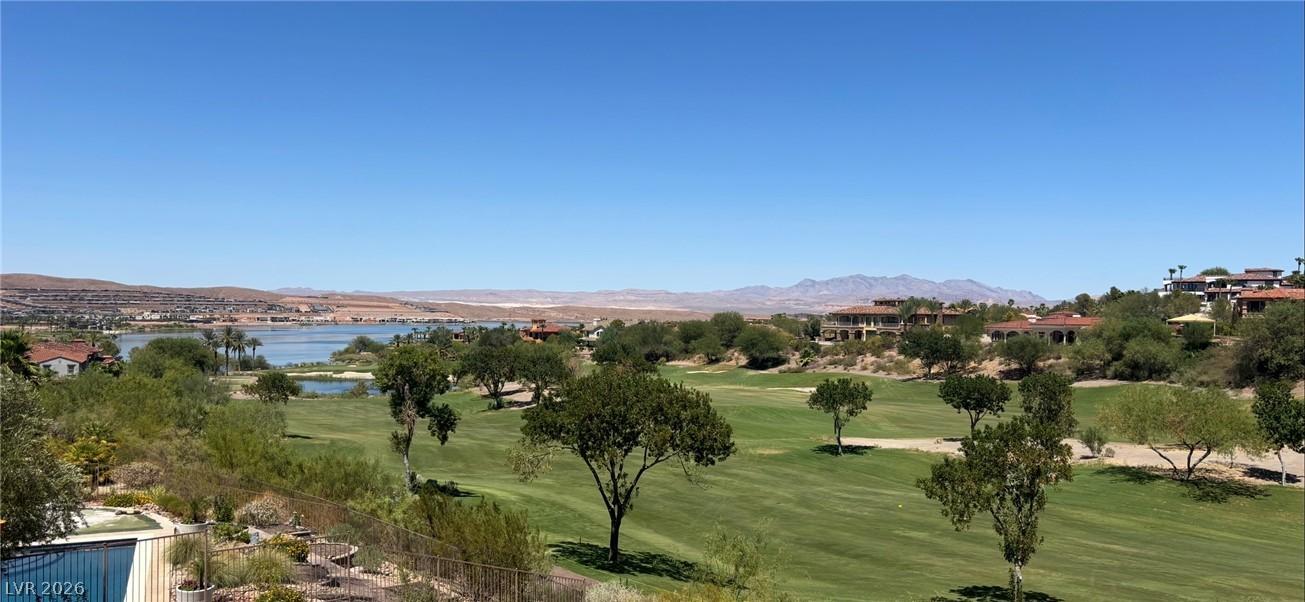 Image 2: A sweeping panorama captures the verdant golf cour