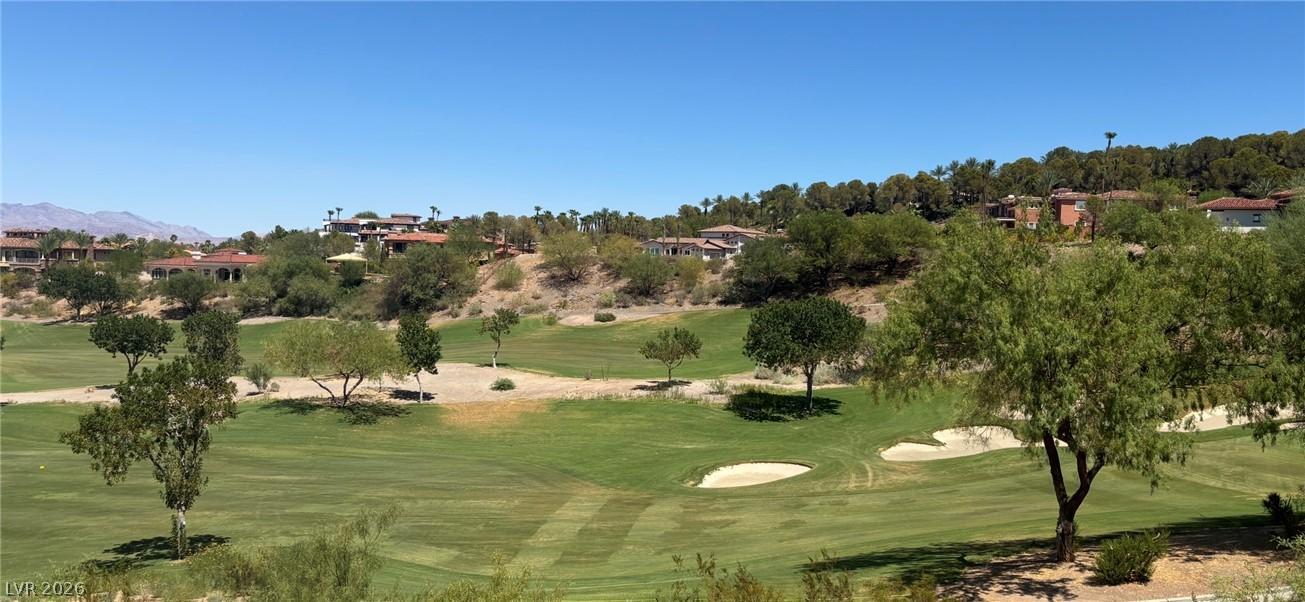 Image 3: Green fairways and sand traps are nestled among ho