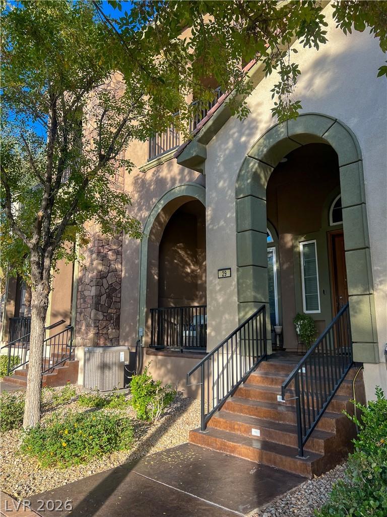 Image 1: Arched entryways welcome guests to this charming r