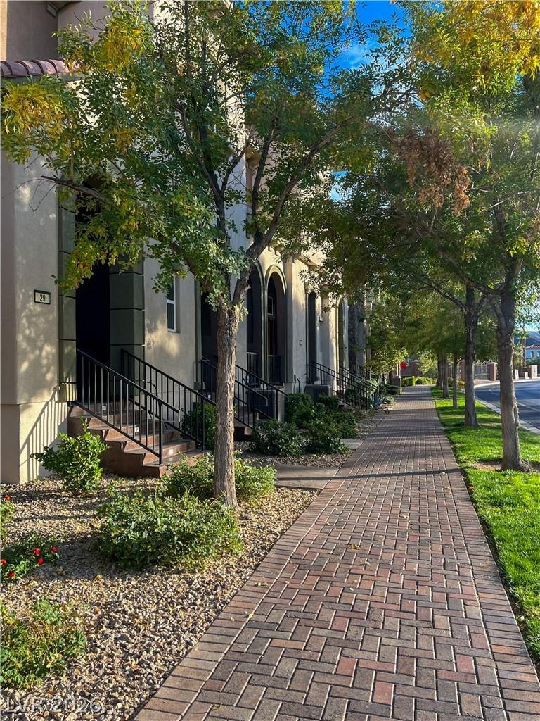Image 2: An inviting brick pathway leads to these charming