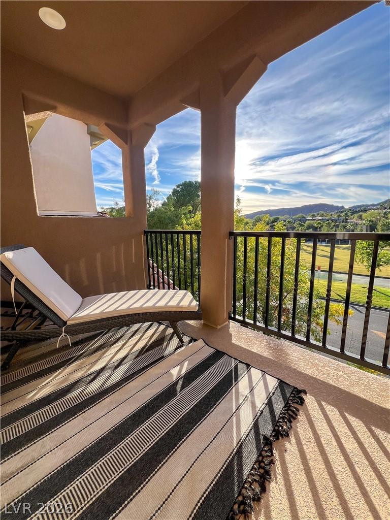 Image 4: An inviting balcony offers serene views of the sur