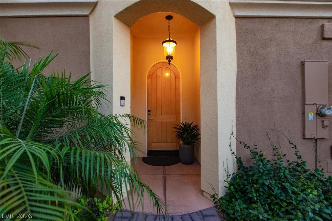 Image 3: An inviting arched entryway features a warm glow,