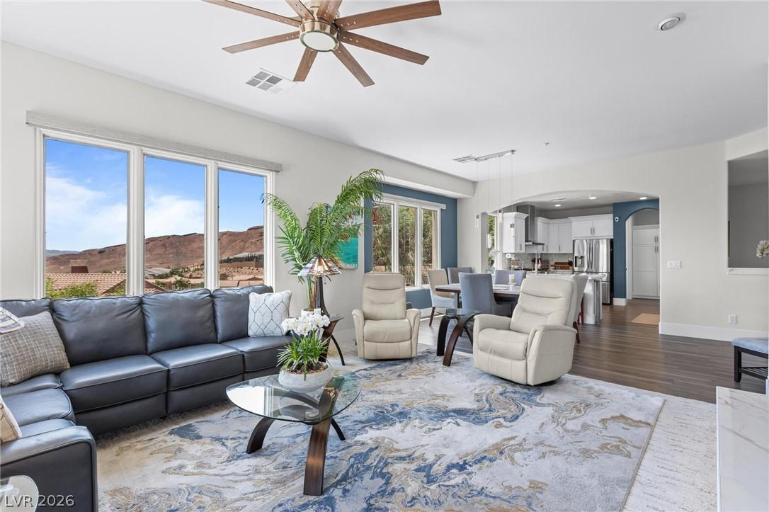 Image 4: A spacious living room offering desert vistas thro