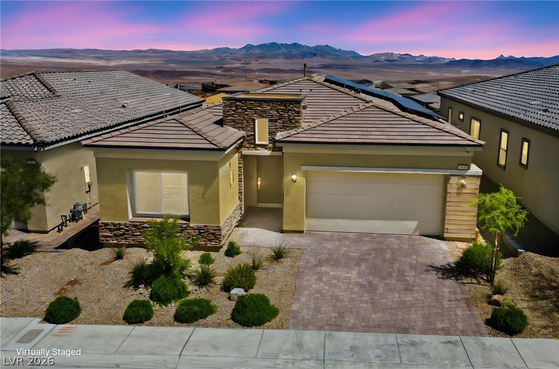 Image 2: A desert oasis with solar panels atop, this home o
