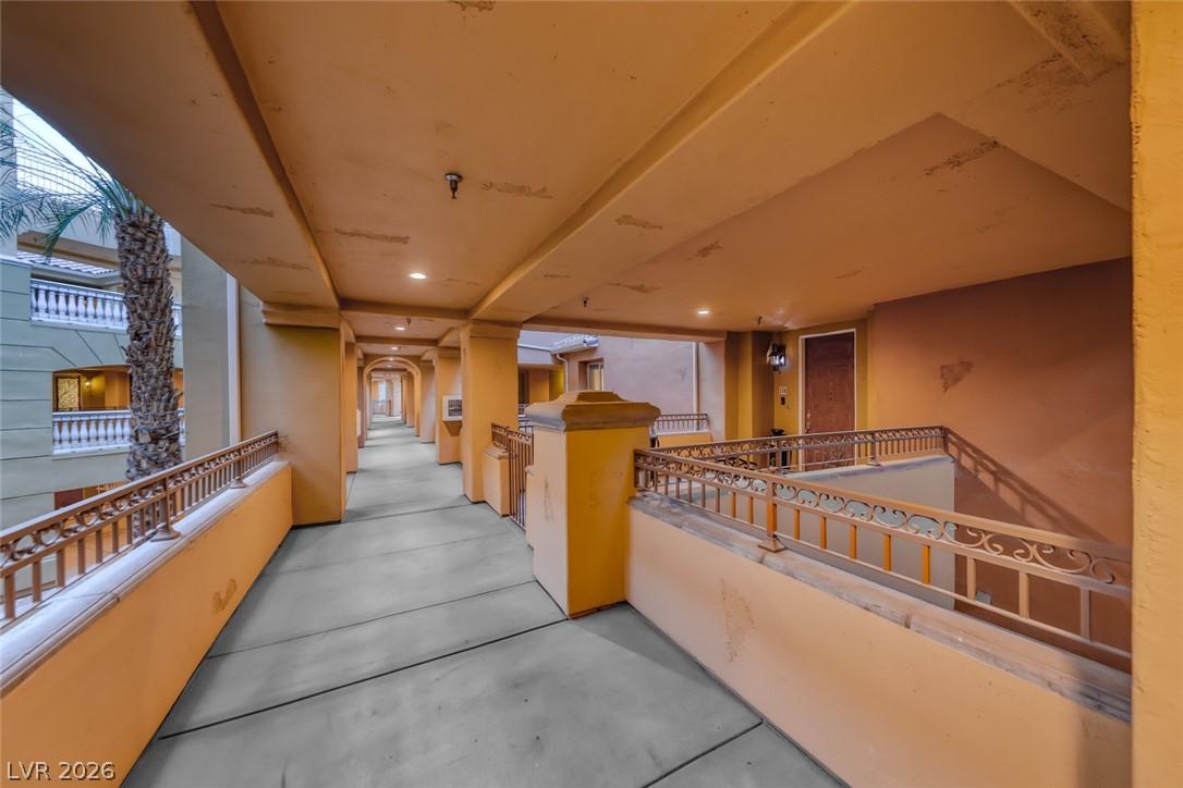 Image 4: A long, covered outdoor walkway features ornate me