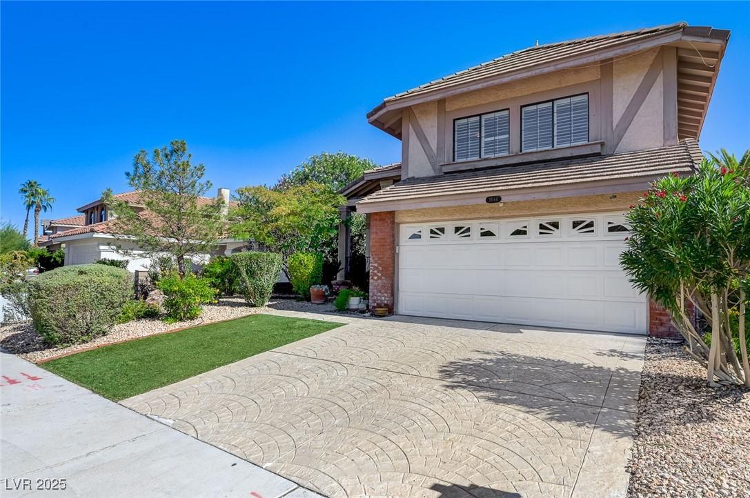 Image 2: Traditional home featuring brick siding, stucco si