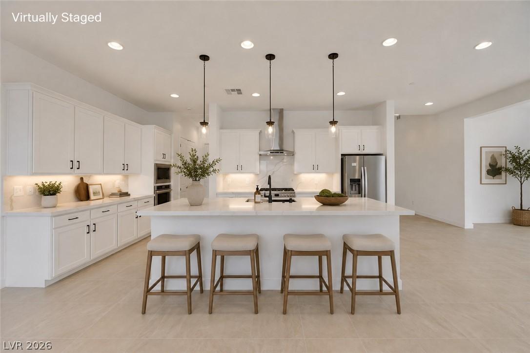 Image 4: A well-appointed kitchen features a generously siz