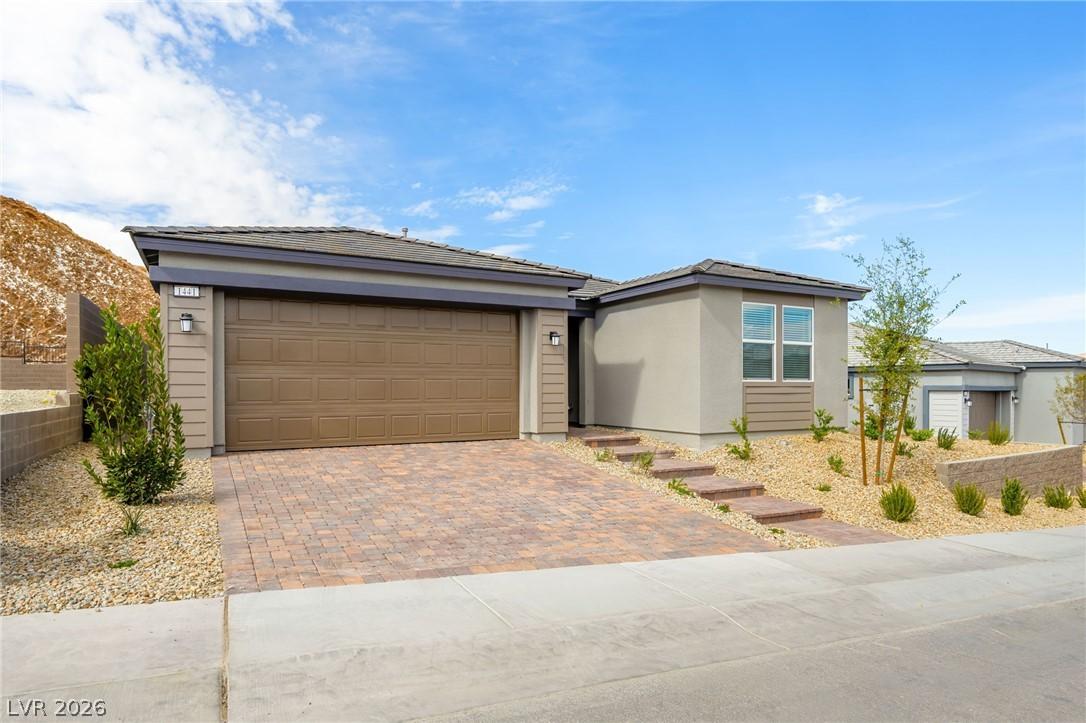 Image 2: A striking modern stucco exterior with an attached