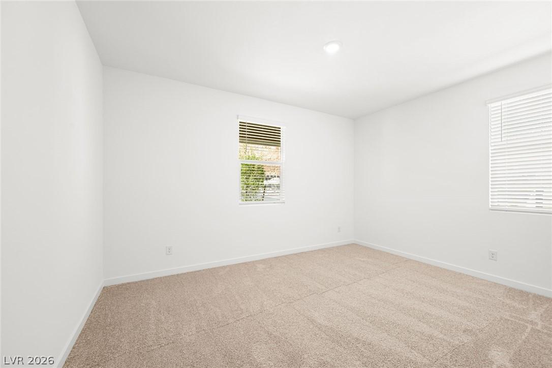 Image 4: A well-lit bedroom offering a blank canvas for per