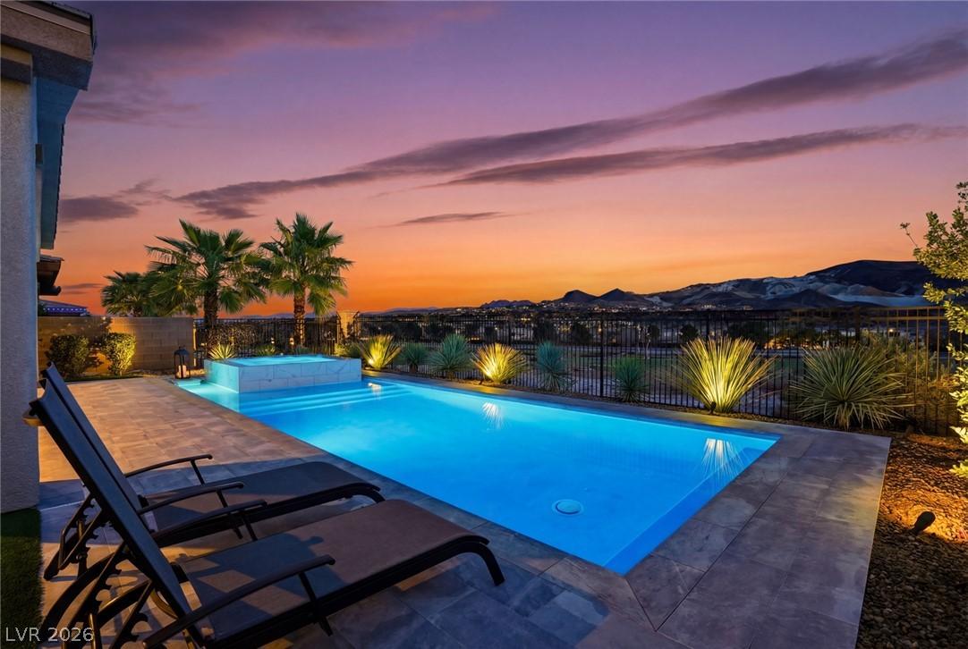 Image 4: Unwind by the shimmering private pool and spa, set