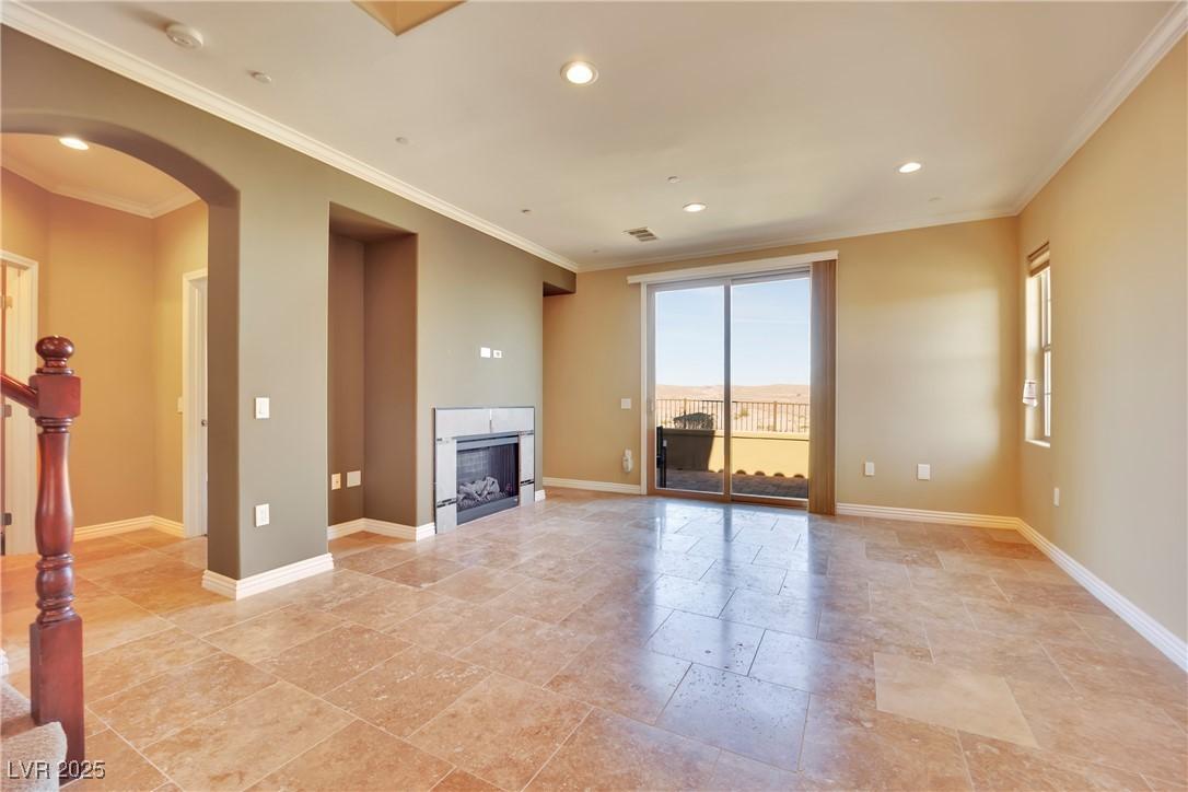 Image 4: Unfurnished living room featuring a fireplace, sta
