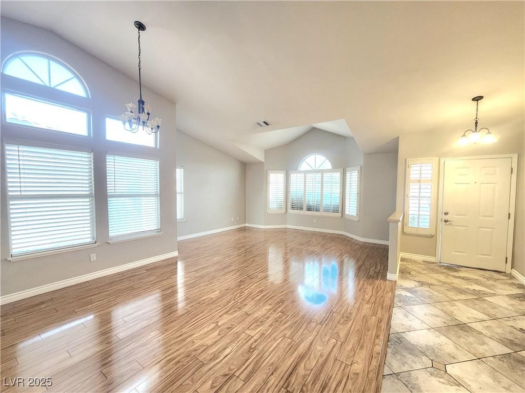 Image 3: Unfurnished living room with a chandelier, lofted