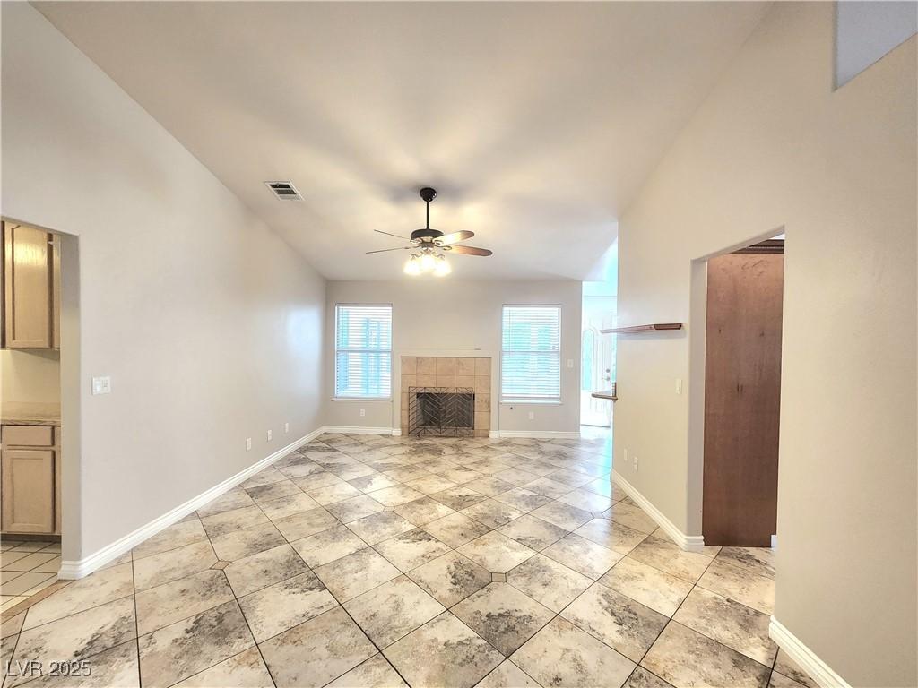 Image 4: Unfurnished living room featuring ceiling fan, a f