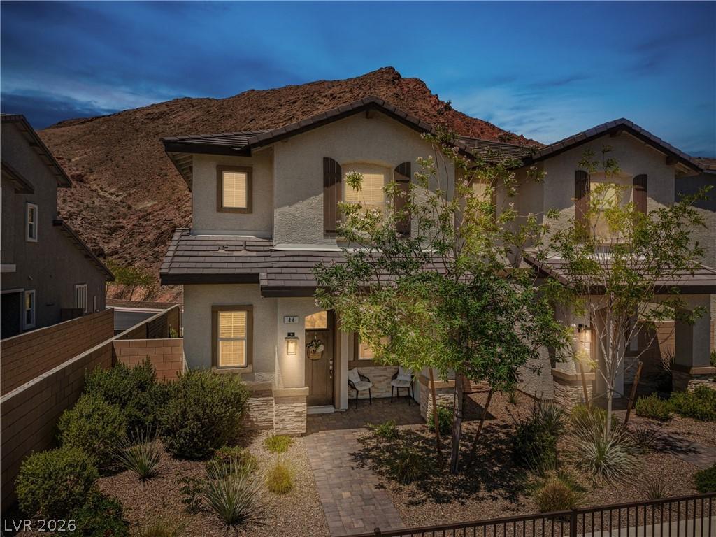 Image 1: This two-story residence features a charming entry