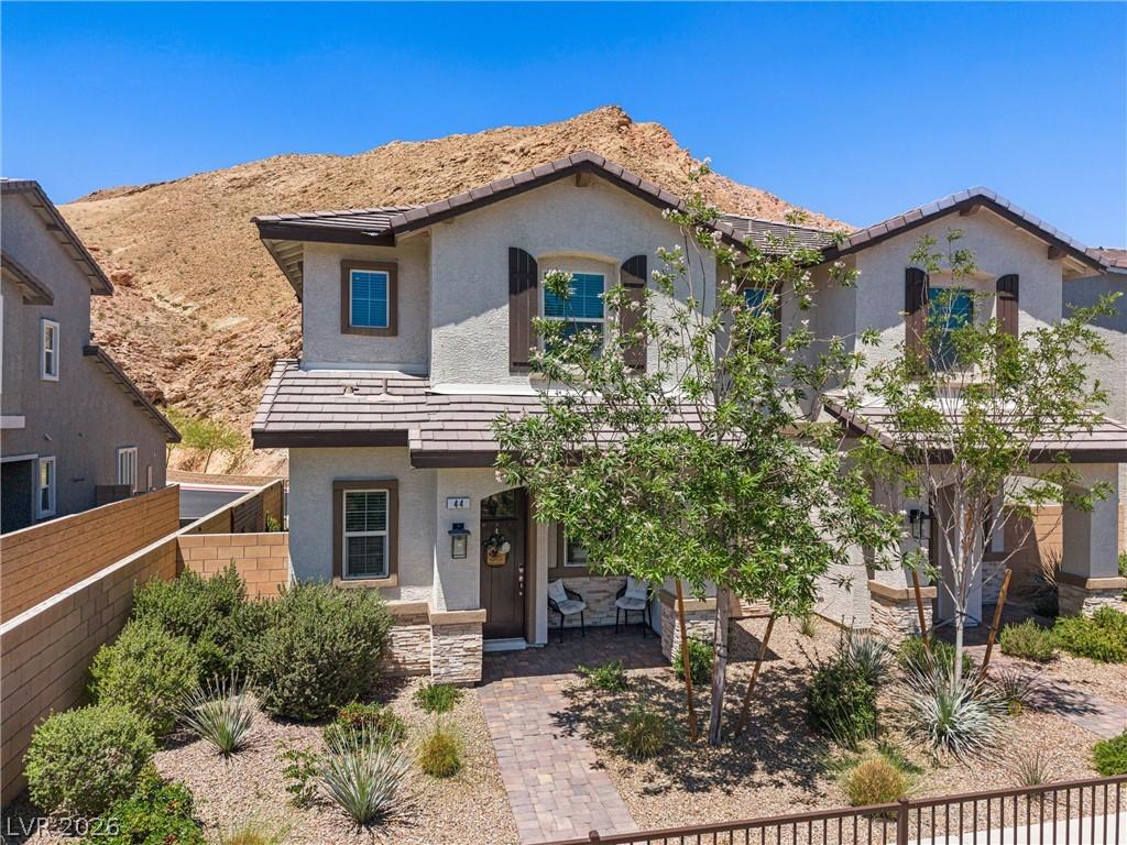 Image 2: This desert dwelling offers charming curb appeal,