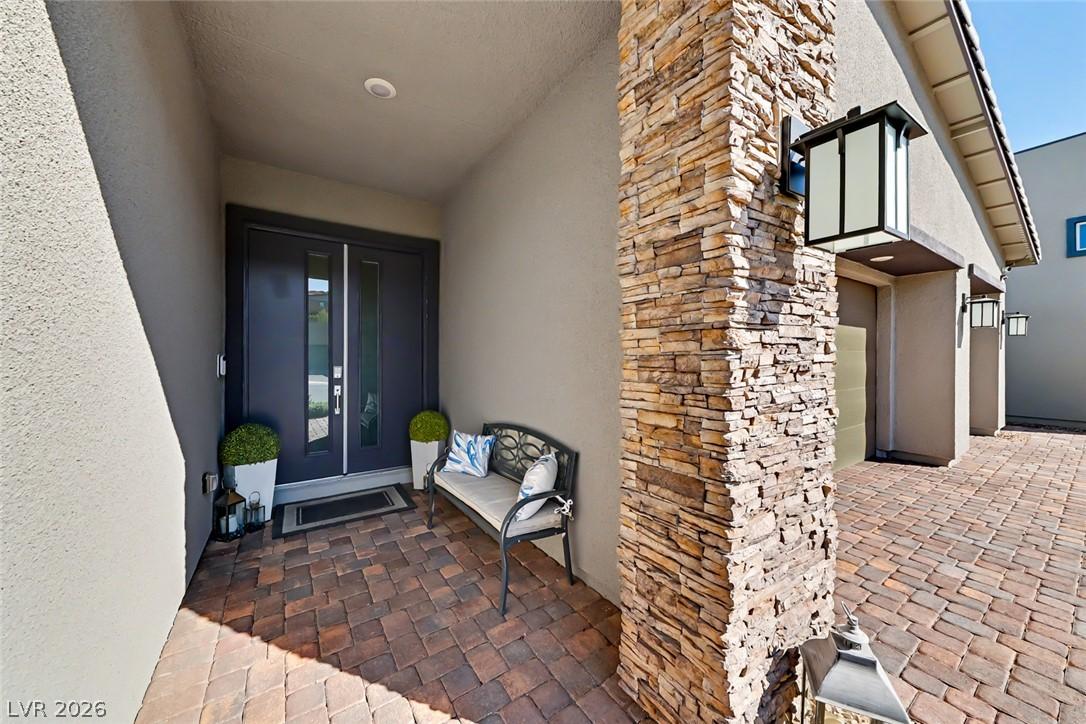 Image 3: A welcoming front entrance featuring dark double d