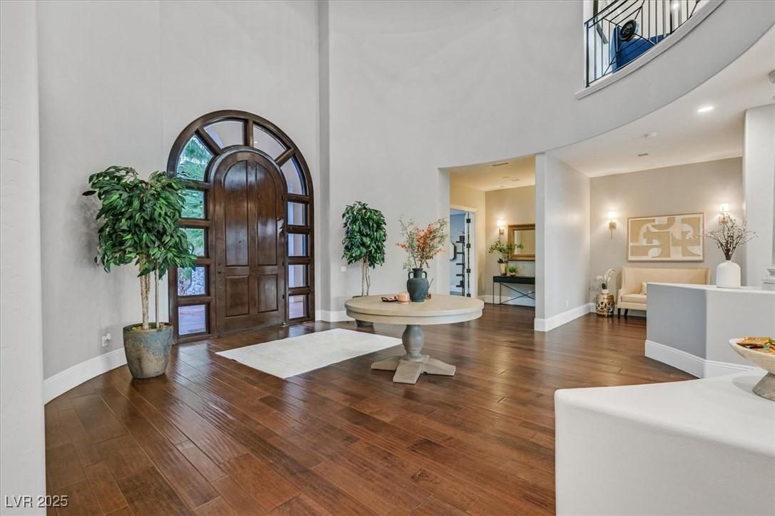 Image 3: Entrance foyer featuring a high ceiling and dark w