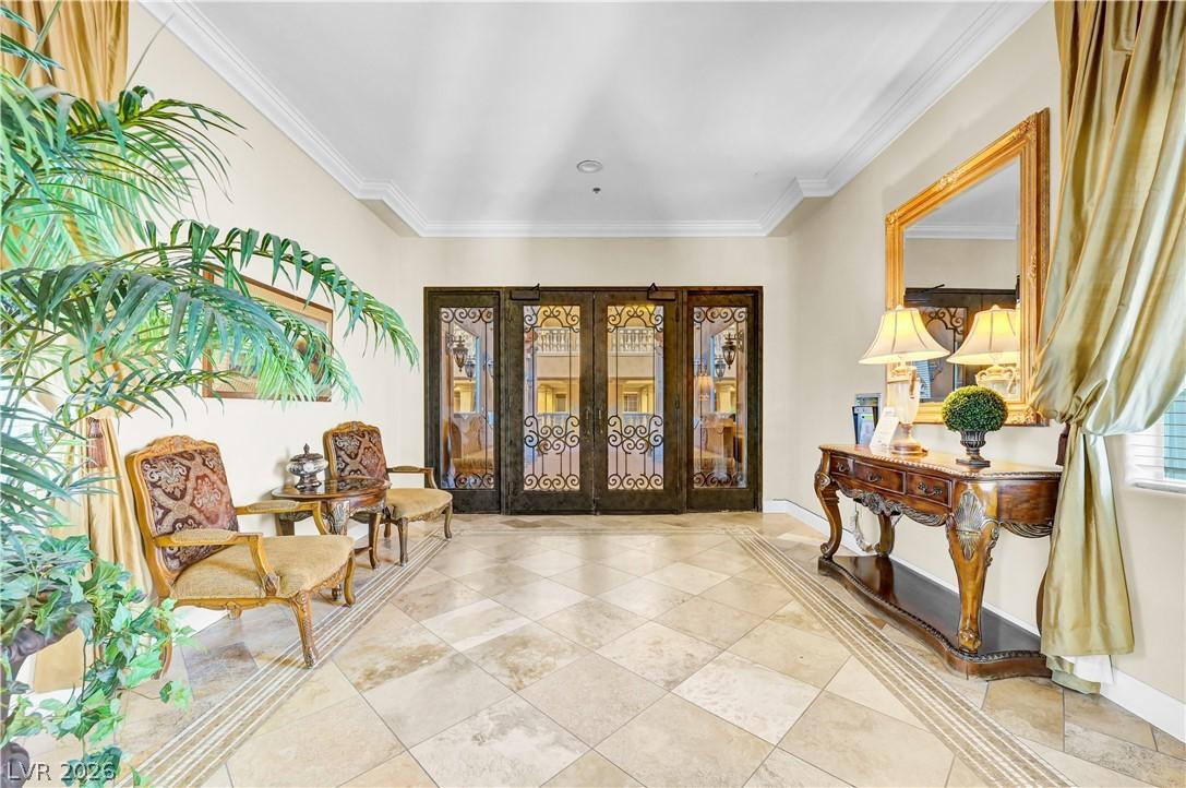 Image 4: Elegant entrance foyer featuring a stately set of