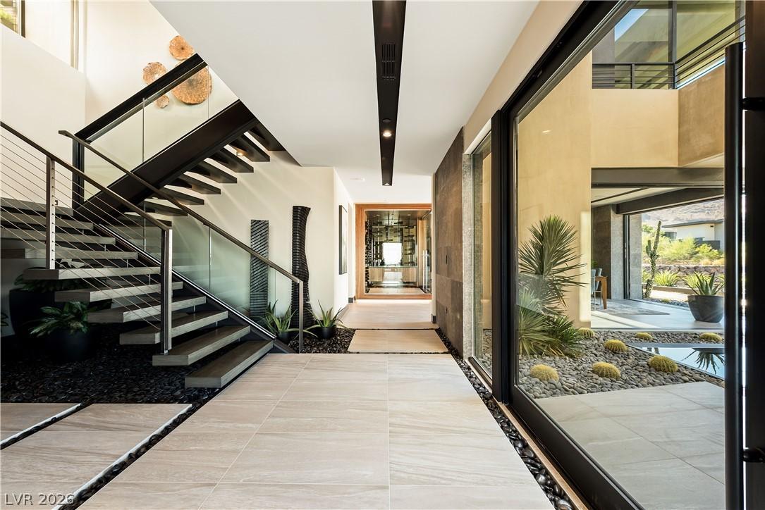 Image 4: Modern interior design with a sleek staircase and