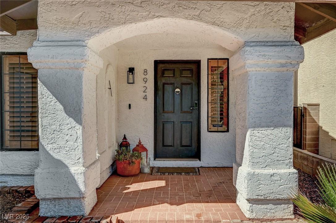 Image 4: View of exterior entry featuring covered porch and