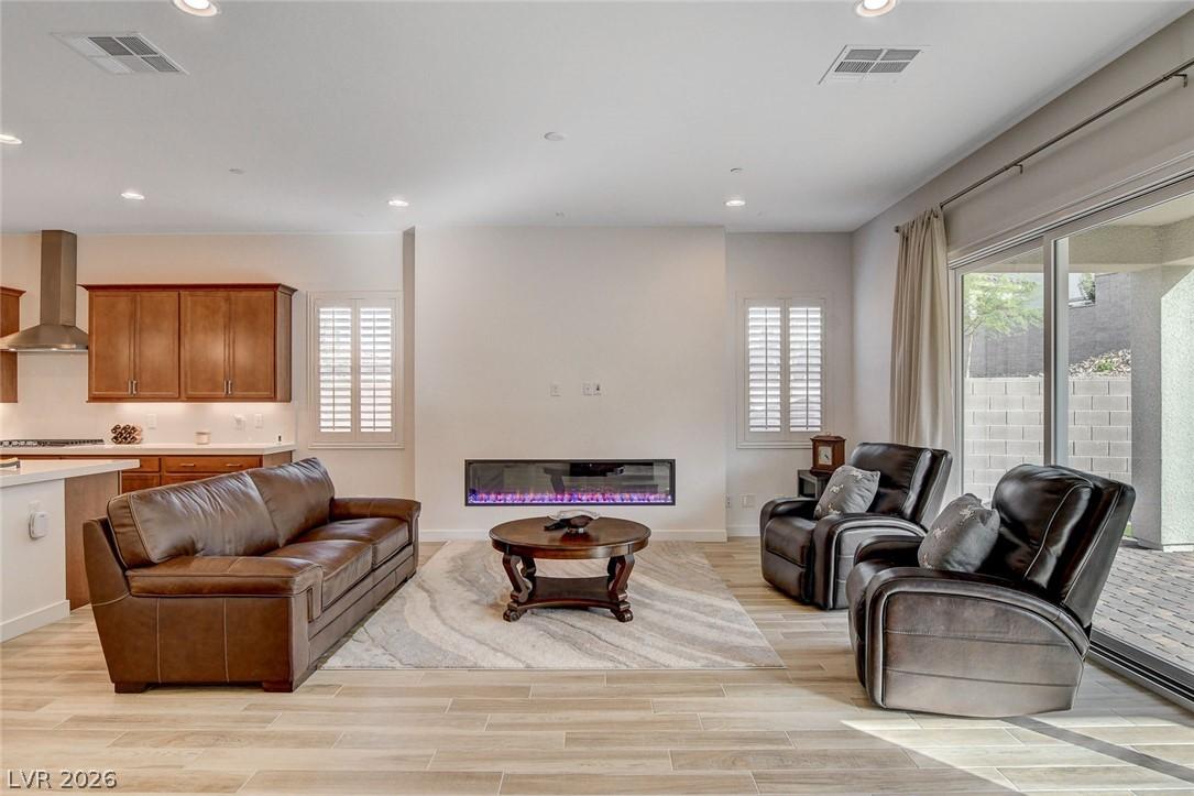 Image 4: Recessed lighting illuminates this open-concept gr