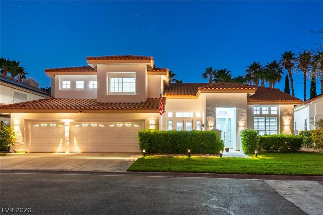 Image 1: Mediterranean / spanish-style home with an attache